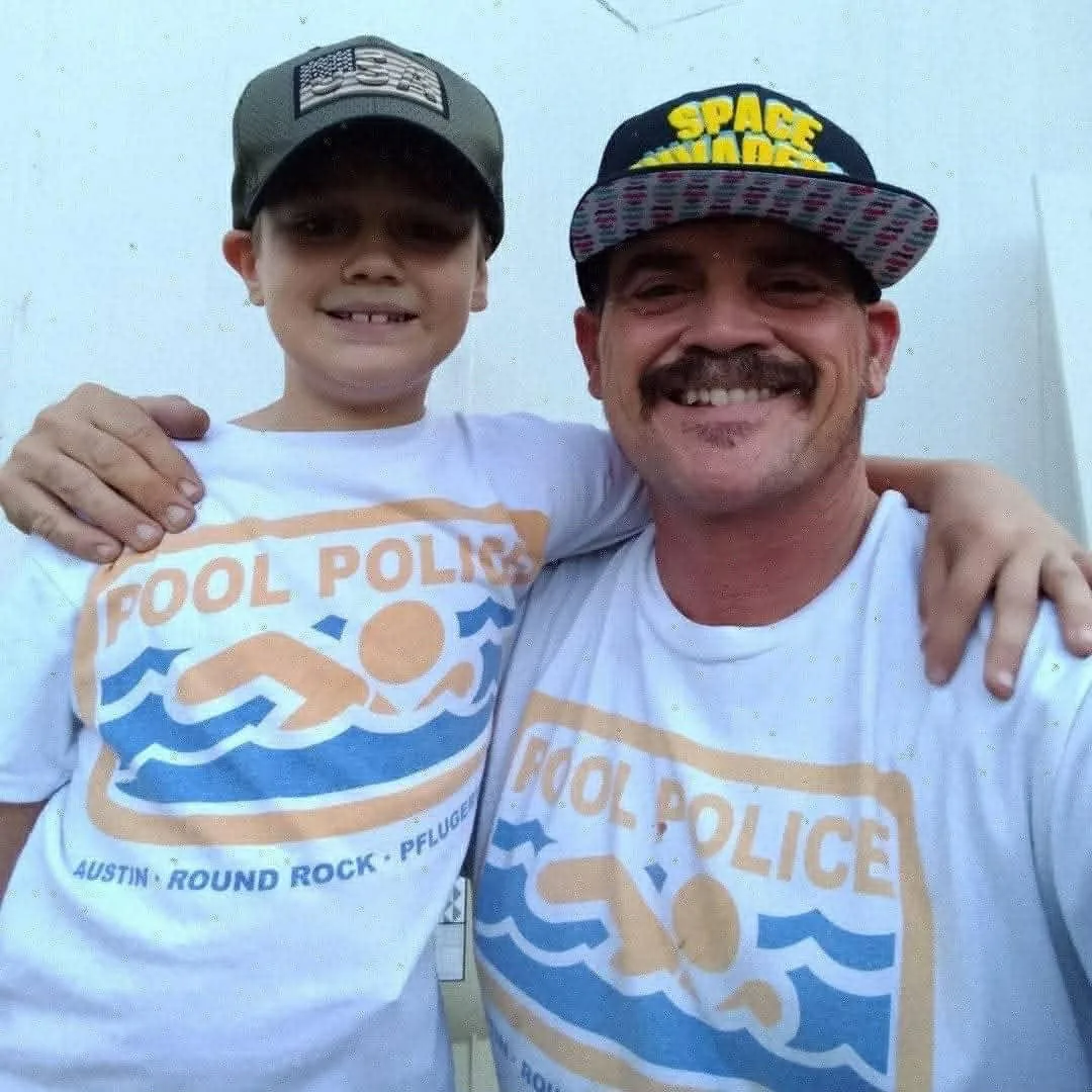 Keith Mallette and son in matching Pool Police shirts — family-owned pool service in Austin TX since 2000