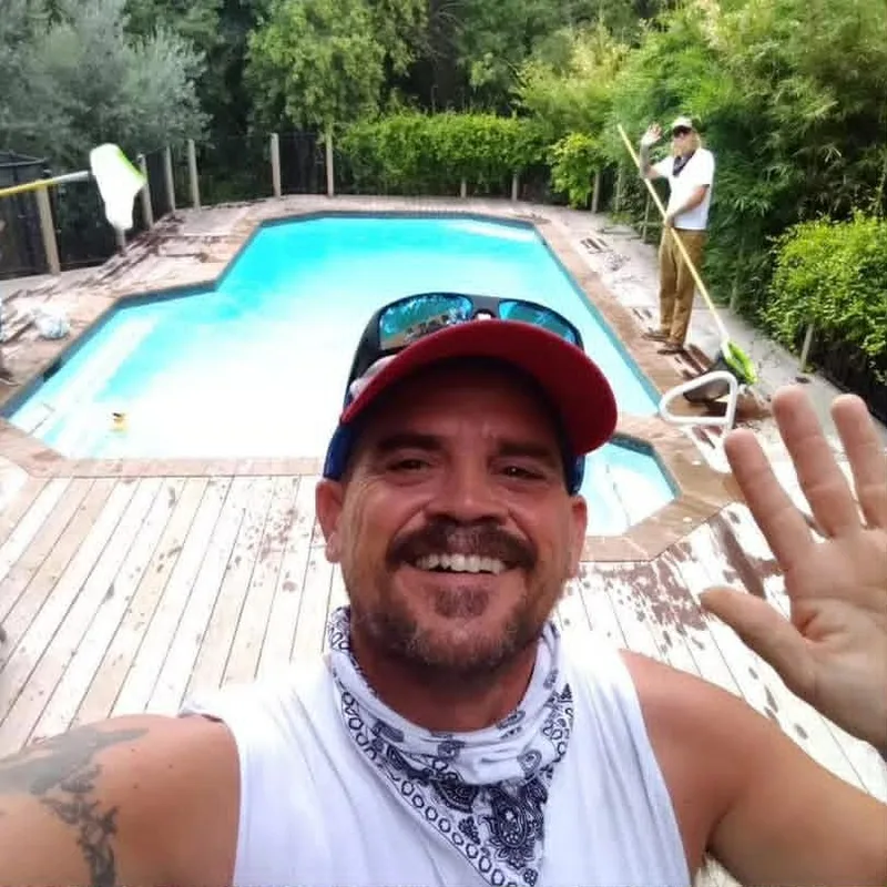 Keith Mallette, owner of The Pool Police, on the job at a backyard pool in Austin TX